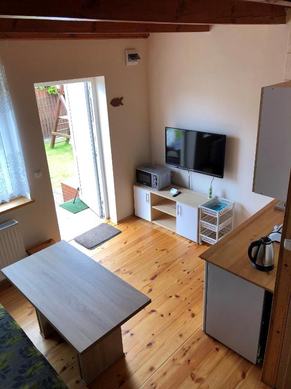 TV a/nebo společenská místnost v ubytování Apartamenty pod dębem