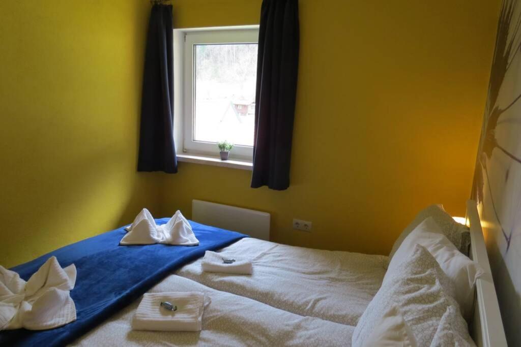 Posteľ alebo postele v izbe v ubytovaní Murzeit Apartman