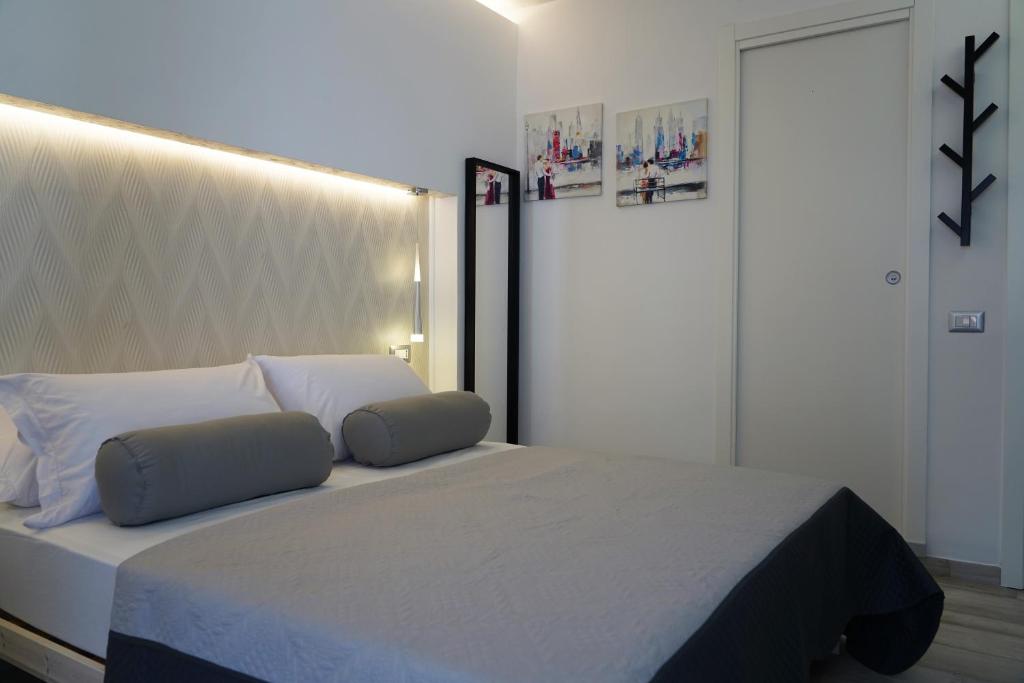 Postel nebo postele na pokoji v ubytování FamiliaINN Rooms & Apartments