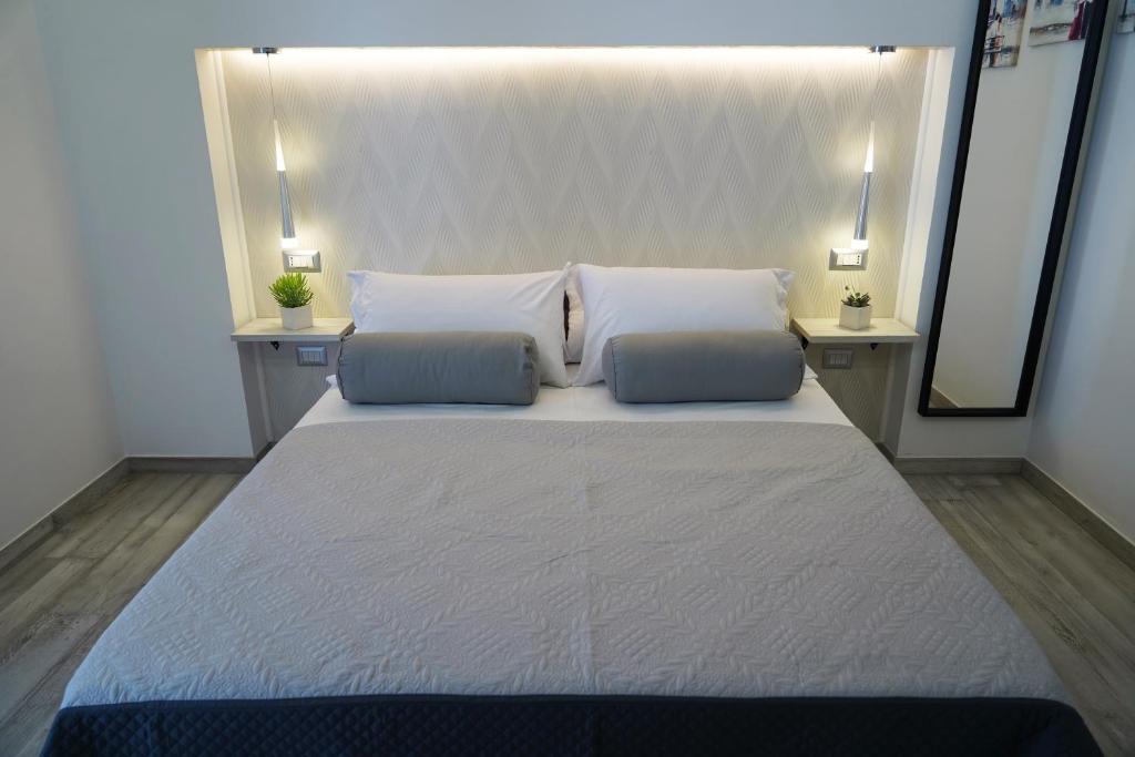 Postel nebo postele na pokoji v ubytování FamiliaINN Rooms & Apartments