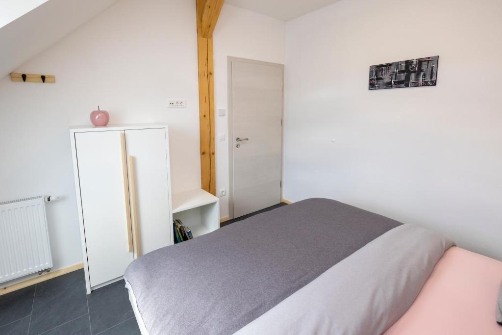 Postel nebo postele na pokoji v ubytování Pr `Agotnik Apartments & Rooms Bohinj