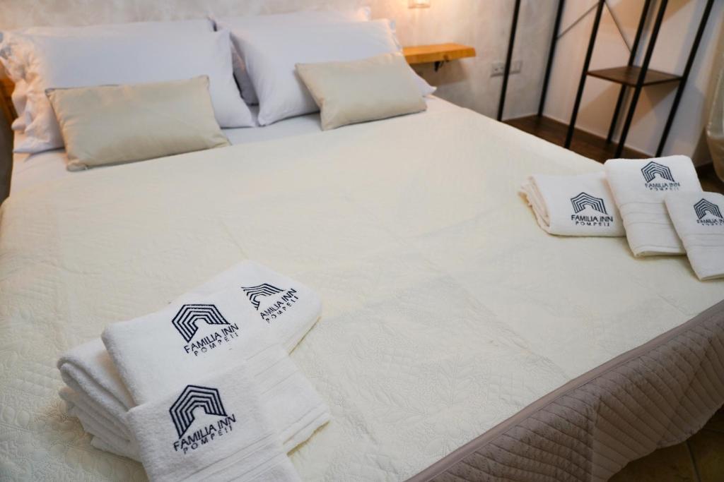 Postel nebo postele na pokoji v ubytování FamiliaINN Rooms & Apartments