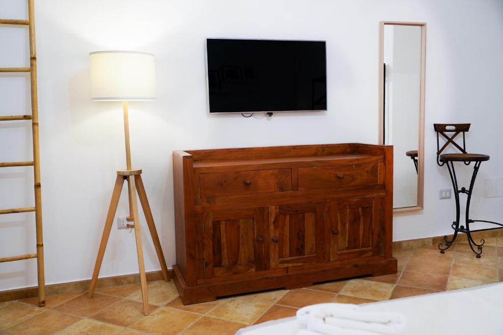 TV a/nebo společenská místnost v ubytování FamiliaINN Rooms & Apartments