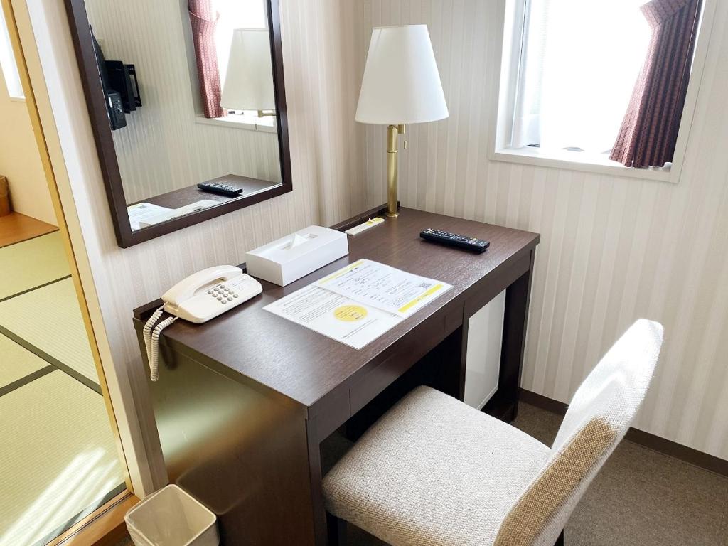 Postel nebo postele na pokoji v ubytování Smile Hotel Kitaasaka