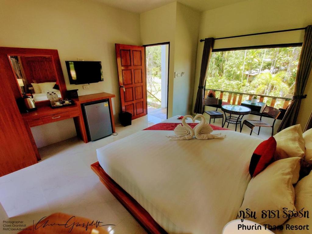 Postel nebo postele na pokoji v ubytování Phurin Thara Resort
