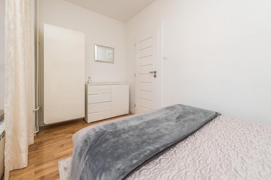 Posteľ alebo postele v izbe v ubytovaní Marina Yacht Apartment