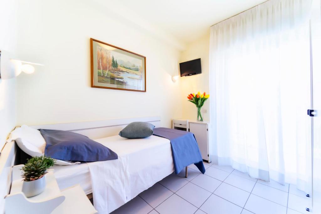Postel nebo postele na pokoji v ubytování Hotel Astra