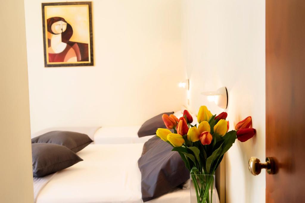Postel nebo postele na pokoji v ubytování Hotel Astra