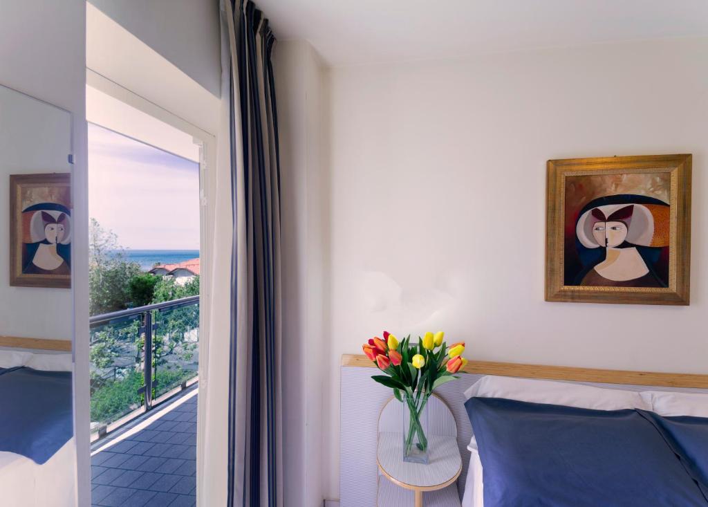 Postel nebo postele na pokoji v ubytování Hotel Astra