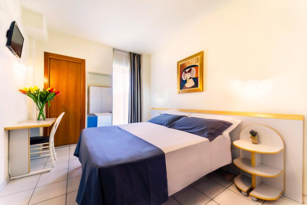 Postel nebo postele na pokoji v ubytování Hotel Astra