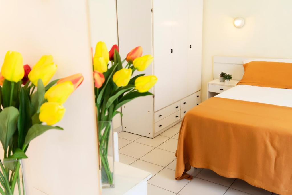 Postel nebo postele na pokoji v ubytování Hotel Astra