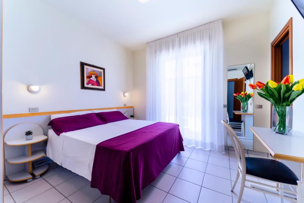 Postel nebo postele na pokoji v ubytování Hotel Astra