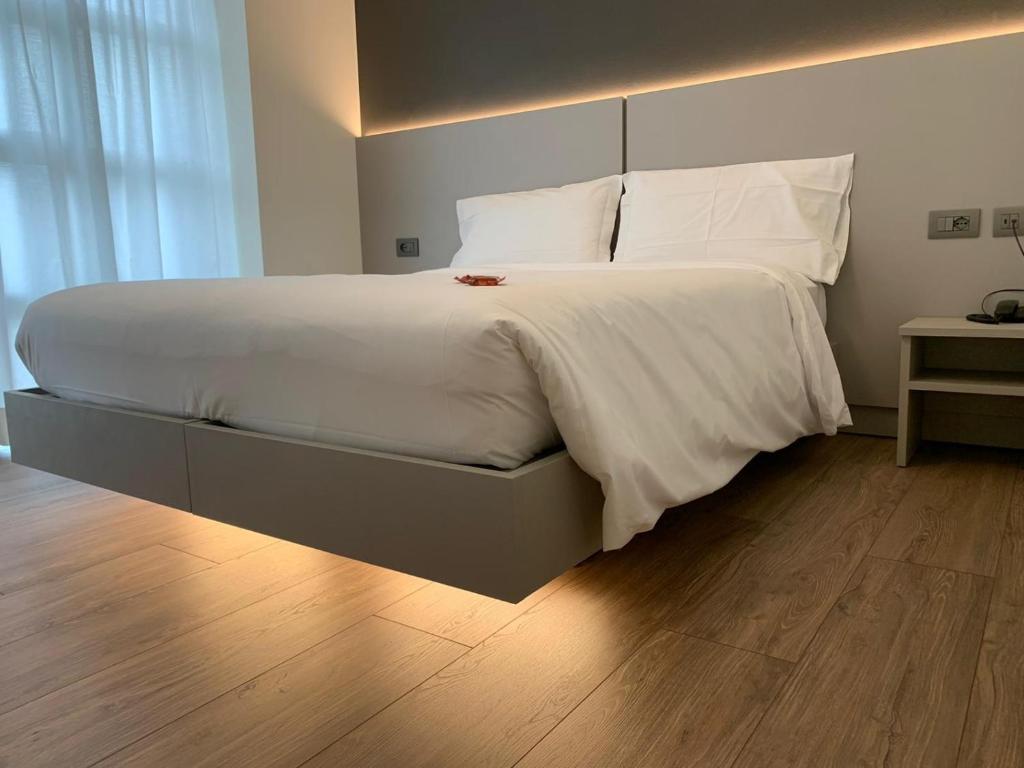 Postel nebo postele na pokoji v ubytování Fly Bike Hotel