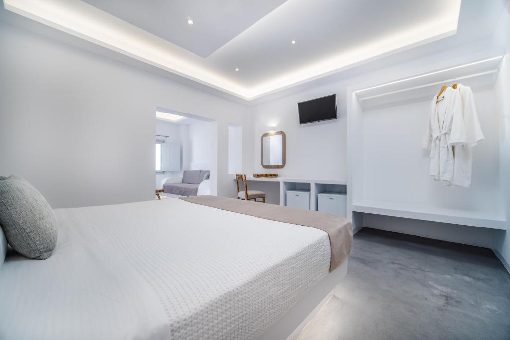 Postel nebo postele na pokoji v ubytování Serenità Luxury Suites