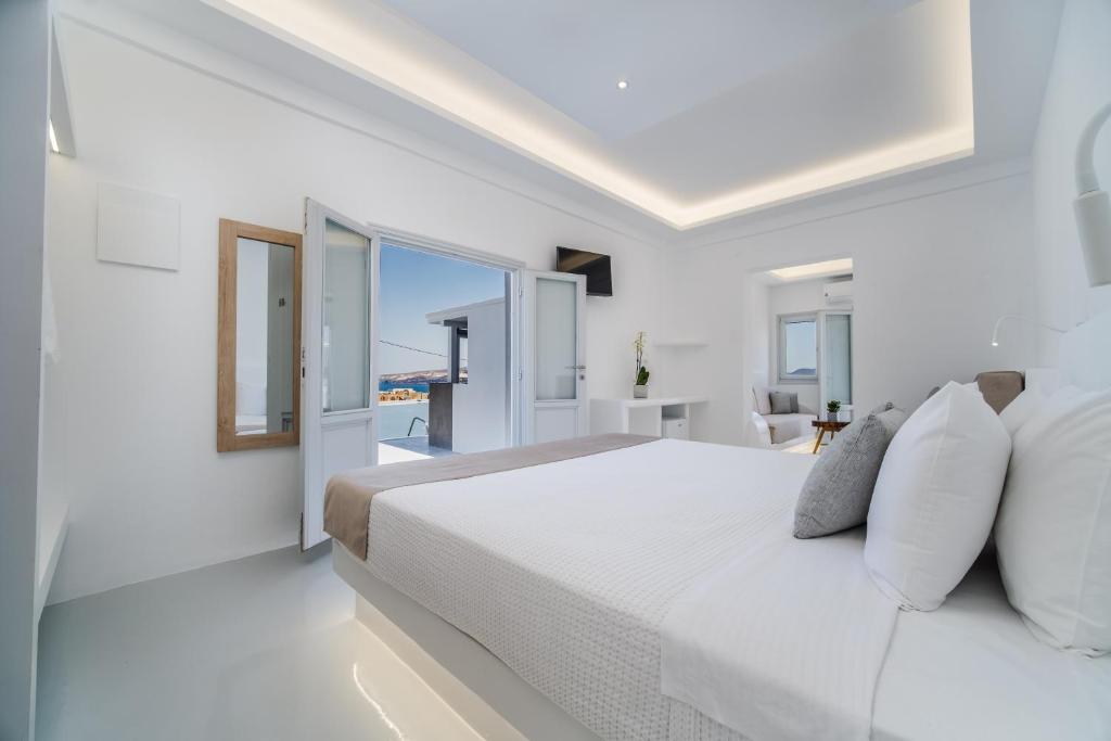 Postel nebo postele na pokoji v ubytování Serenità Luxury Suites