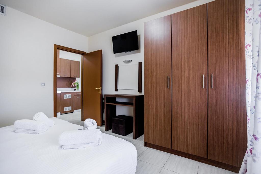 Łóżko lub łóżka w pokoju w obiekcie Thalassa Apart Hotel