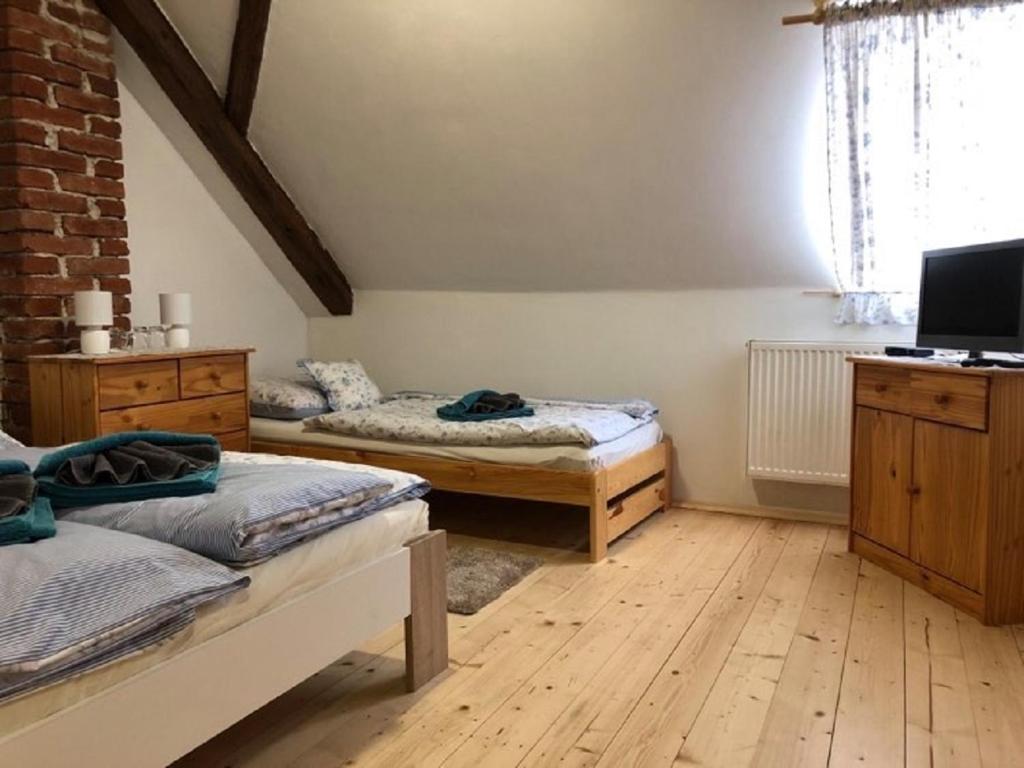 Postel nebo postele na pokoji v ubytování Schwarzenberský panský dvůr