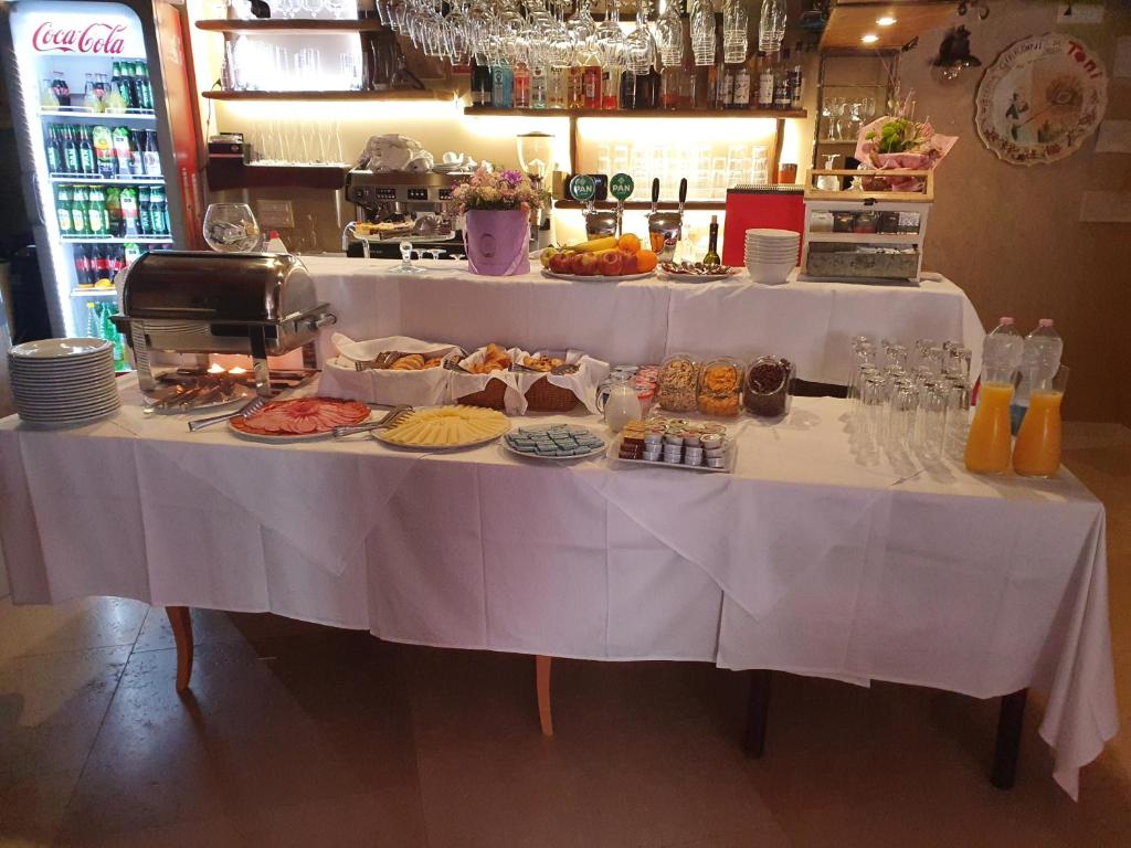a table with a buffet of food on it at Boutique Hotel Melissa in Poreč