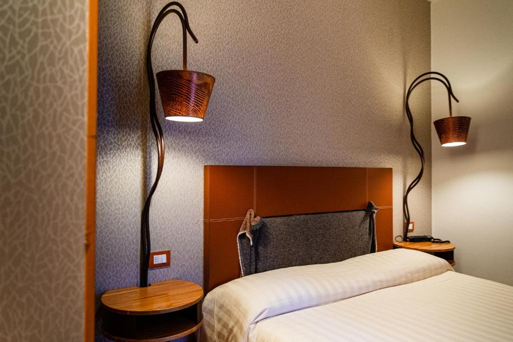 Postel nebo postele na pokoji v ubytování Hotel Langhe
