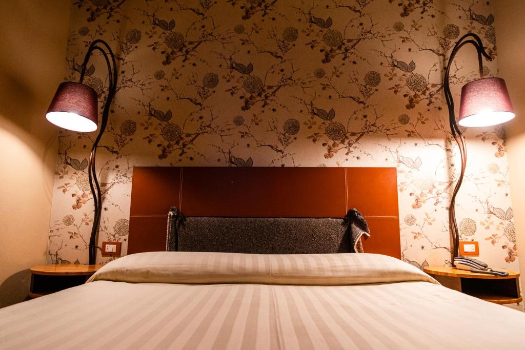 Postel nebo postele na pokoji v ubytování Hotel Langhe