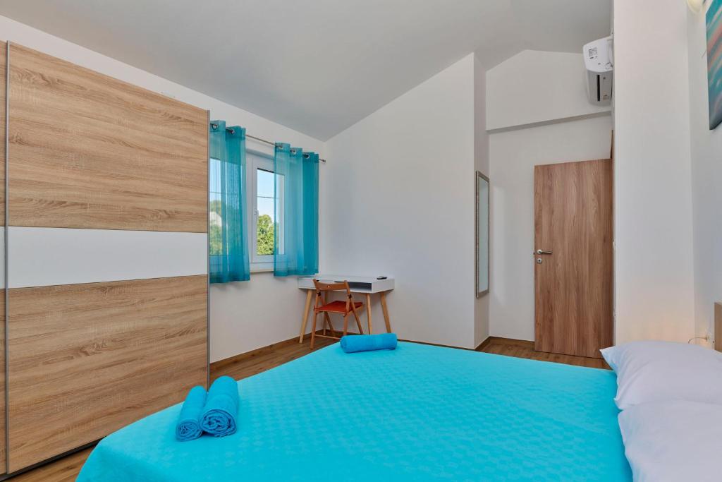 Łóżko lub łóżka w pokoju w obiekcie Apartment Olivix