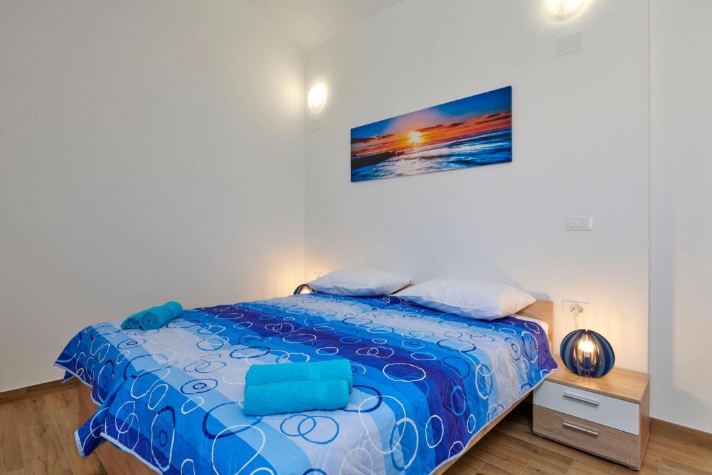Łóżko lub łóżka w pokoju w obiekcie Apartment Olivix
