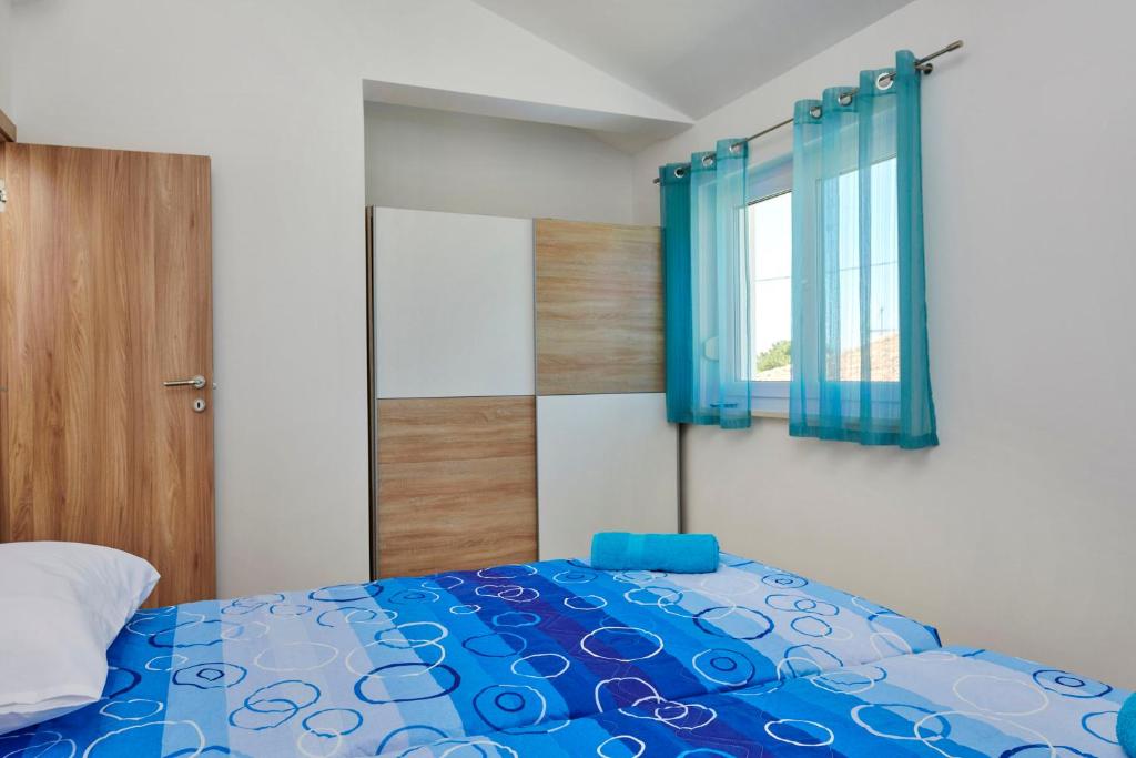 Łóżko lub łóżka w pokoju w obiekcie Apartment Olivix