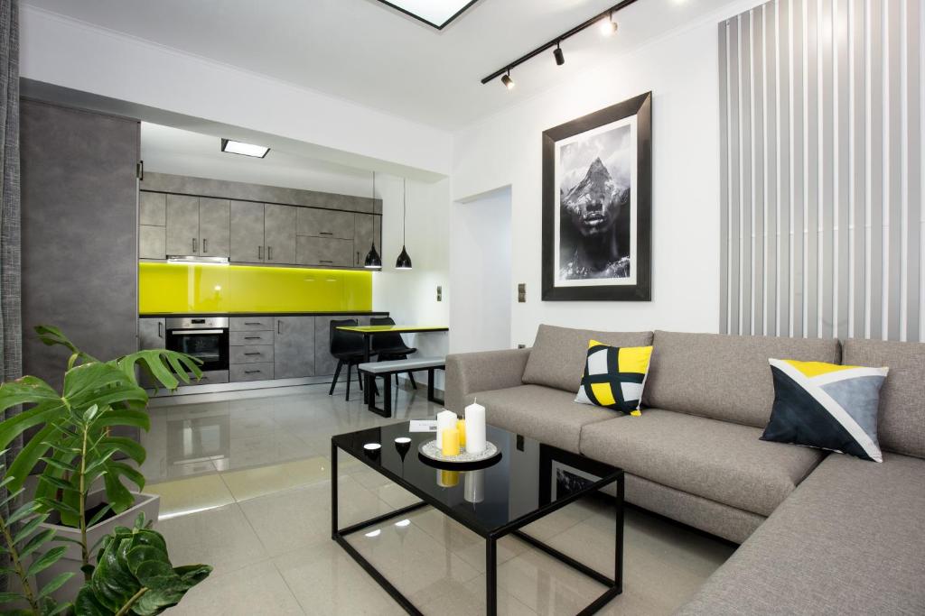 a living room with a couch and a table at Villagio House in Falasarna