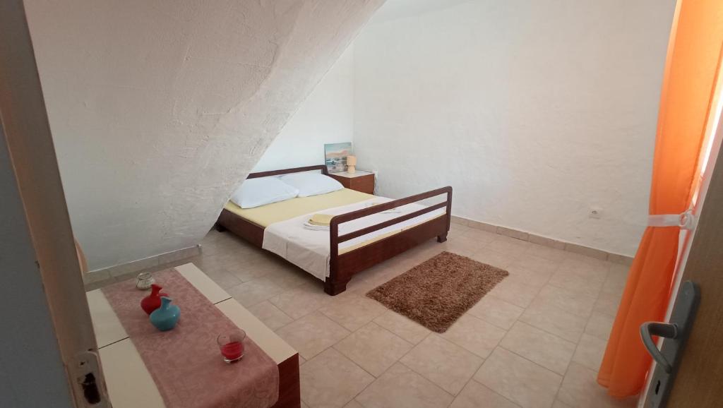 Una cama o camas en una habitación de Vila Kula