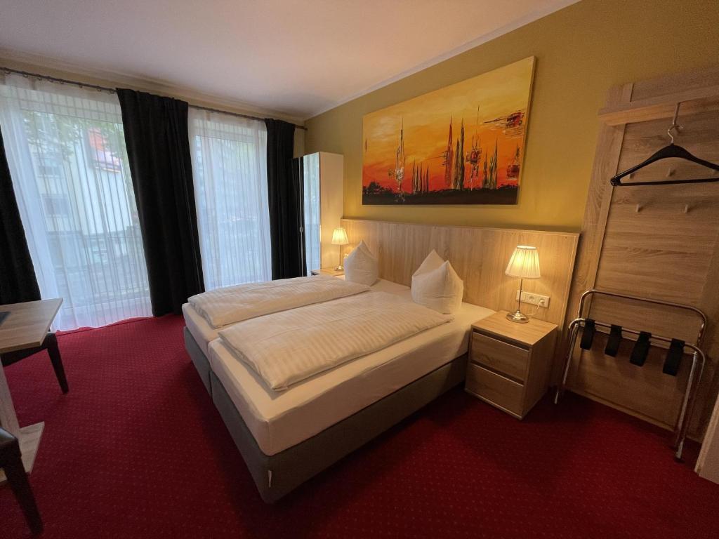 A bed or beds in a room at Select Premium Hotel & Apartments