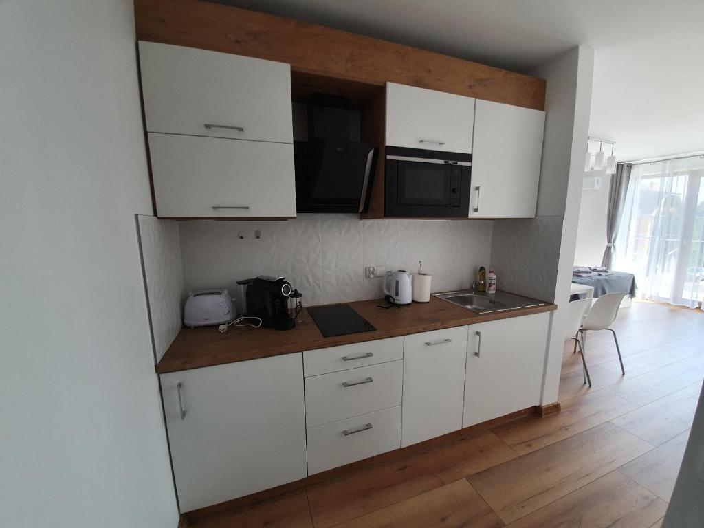 Kuchyň nebo kuchyňský kout v ubytování Willa Alexandra