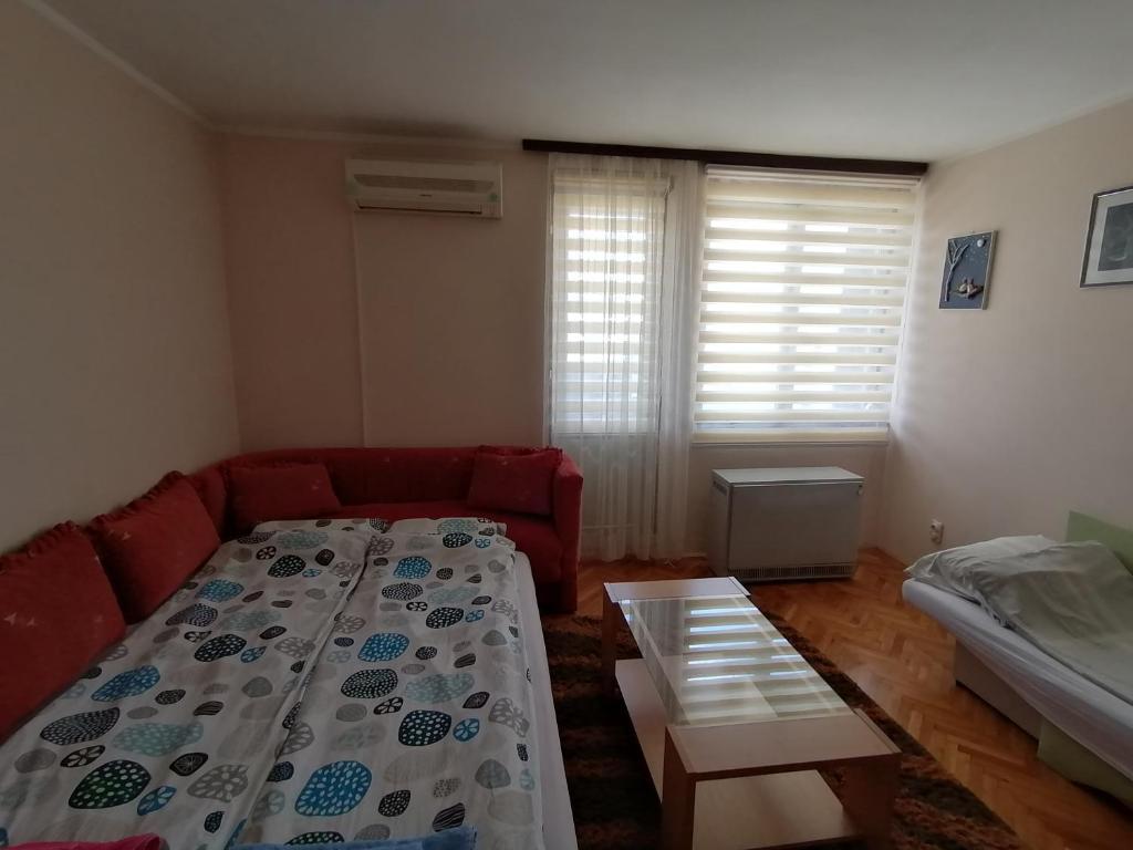 Postel nebo postele na pokoji v ubytování Apartman LENA