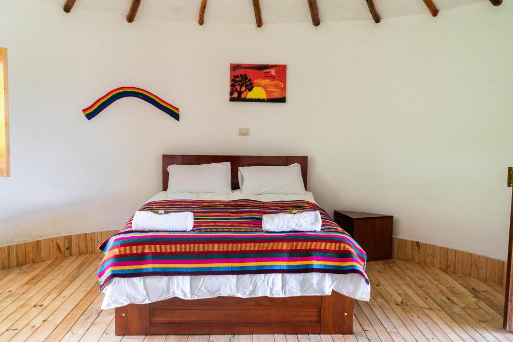 Postel nebo postele na pokoji v ubytování Tullpa Rumy Lodge
