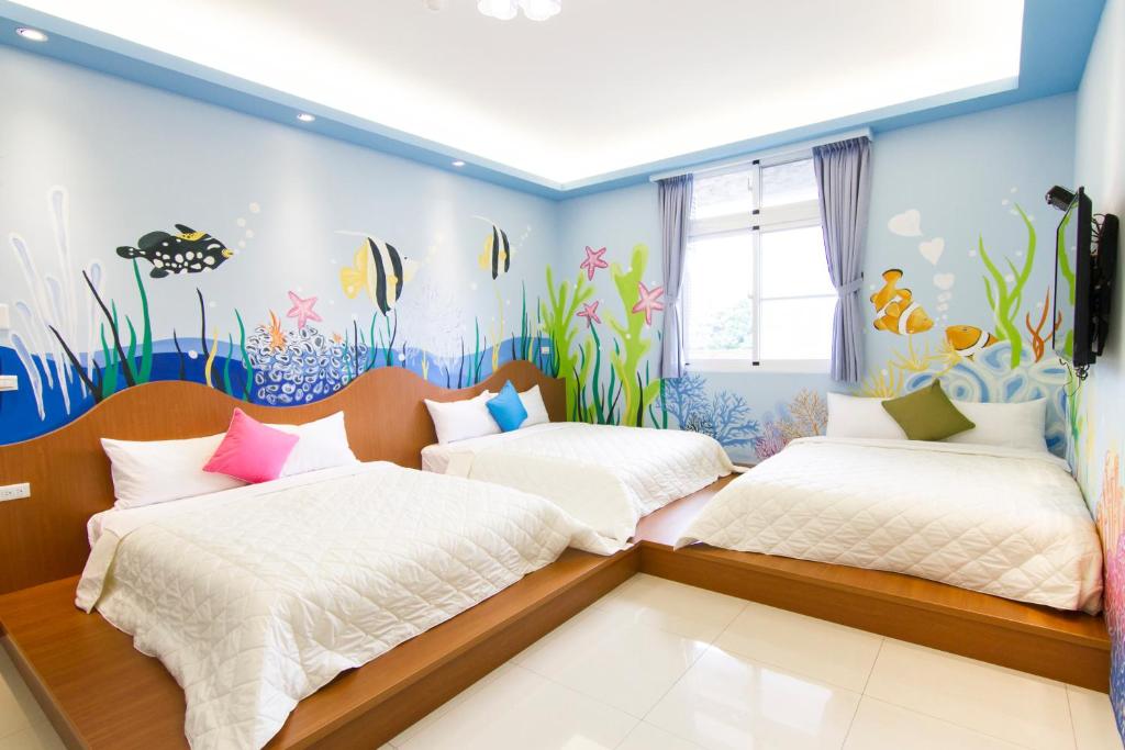 Postel nebo postele na pokoji v ubytování Mu Yu B&B