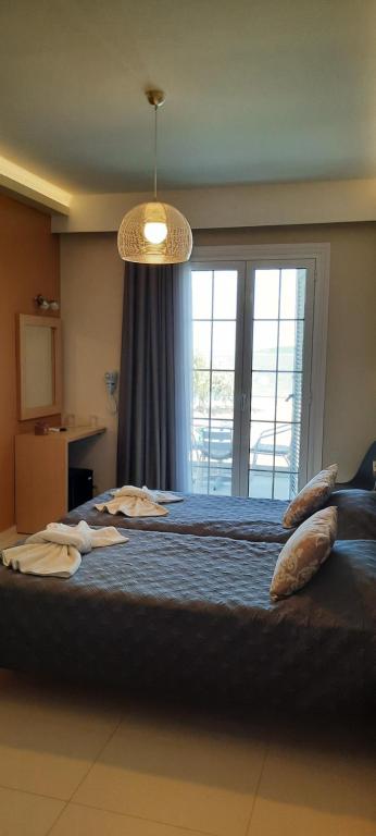 Postel nebo postele na pokoji v ubytování ANGELO Cafe Hotel