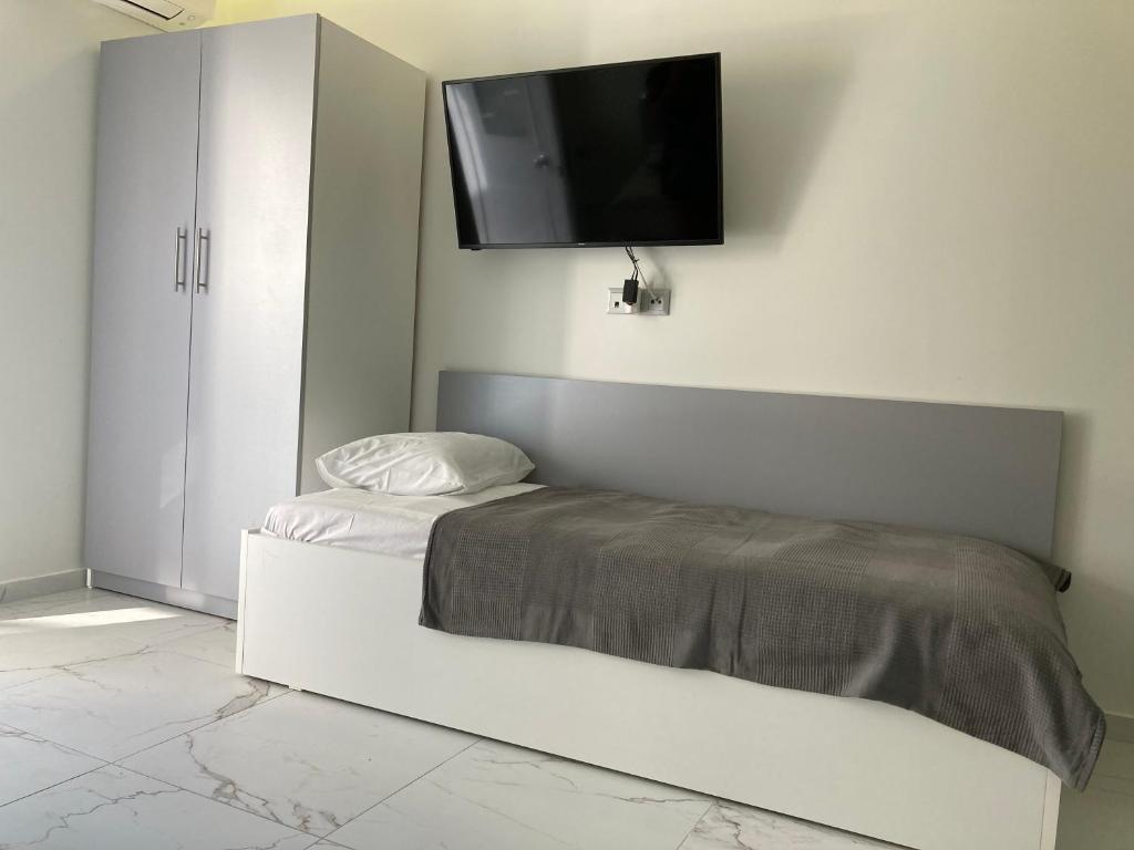 Postel nebo postele na pokoji v ubytování Luka 1 Aparts Polichrono
