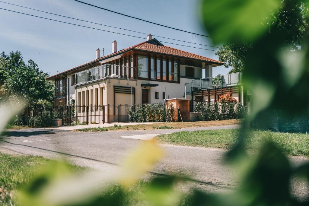 a house on the side of a road at Villa Tília Balatongyörök in Balatongyörök