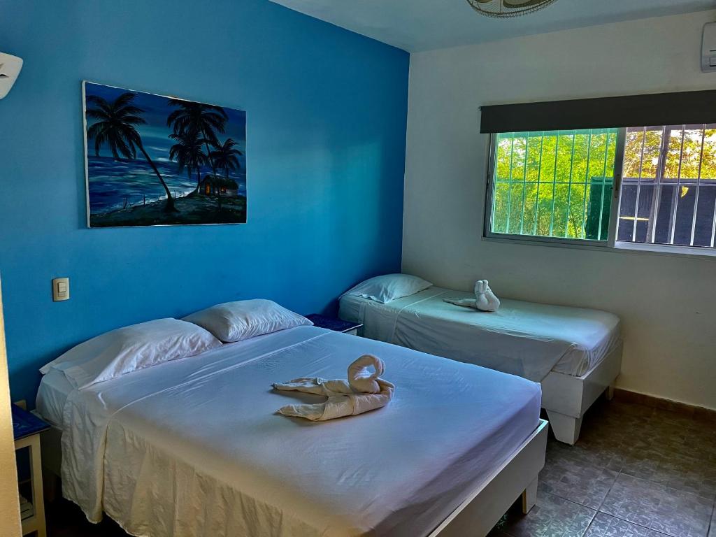 Postel nebo postele na pokoji v ubytování Albergo El Pulpo, Bayahíbe