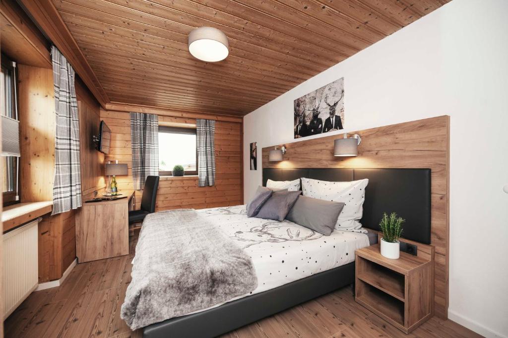 Postel nebo postele na pokoji v ubytování Golf & Ski Chalet