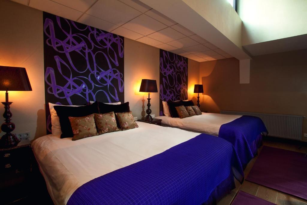 Postel nebo postele na pokoji v ubytování Hotel Sebastians