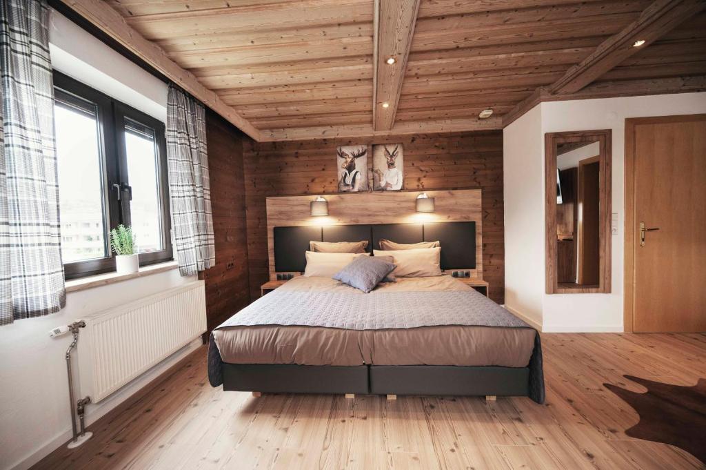 Postel nebo postele na pokoji v ubytování Golf & Ski Chalet