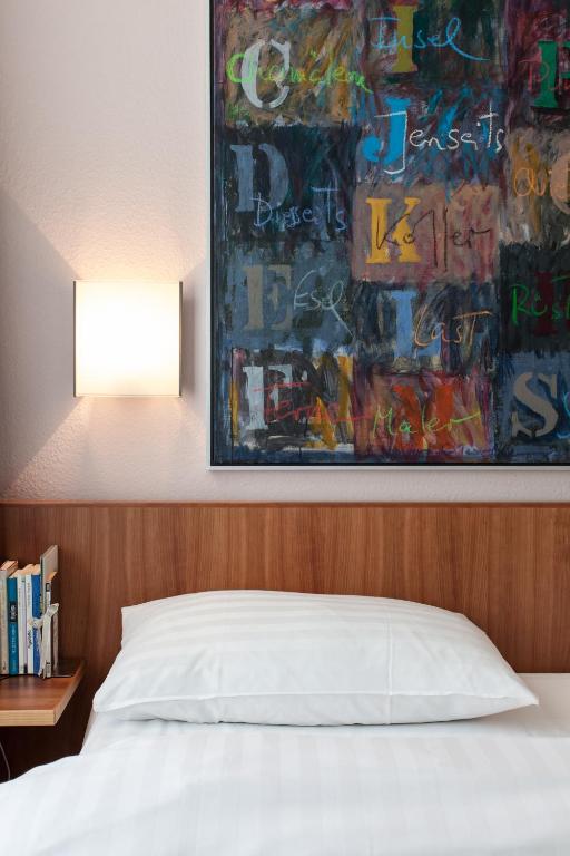 Llit o llits en una habitació de Altstadt Hotel