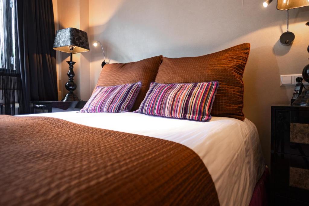 Postel nebo postele na pokoji v ubytování Hotel Sebastians