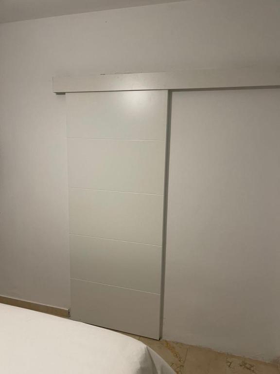 Łóżko lub łóżka w pokoju w obiekcie Apartamento Rio Mar