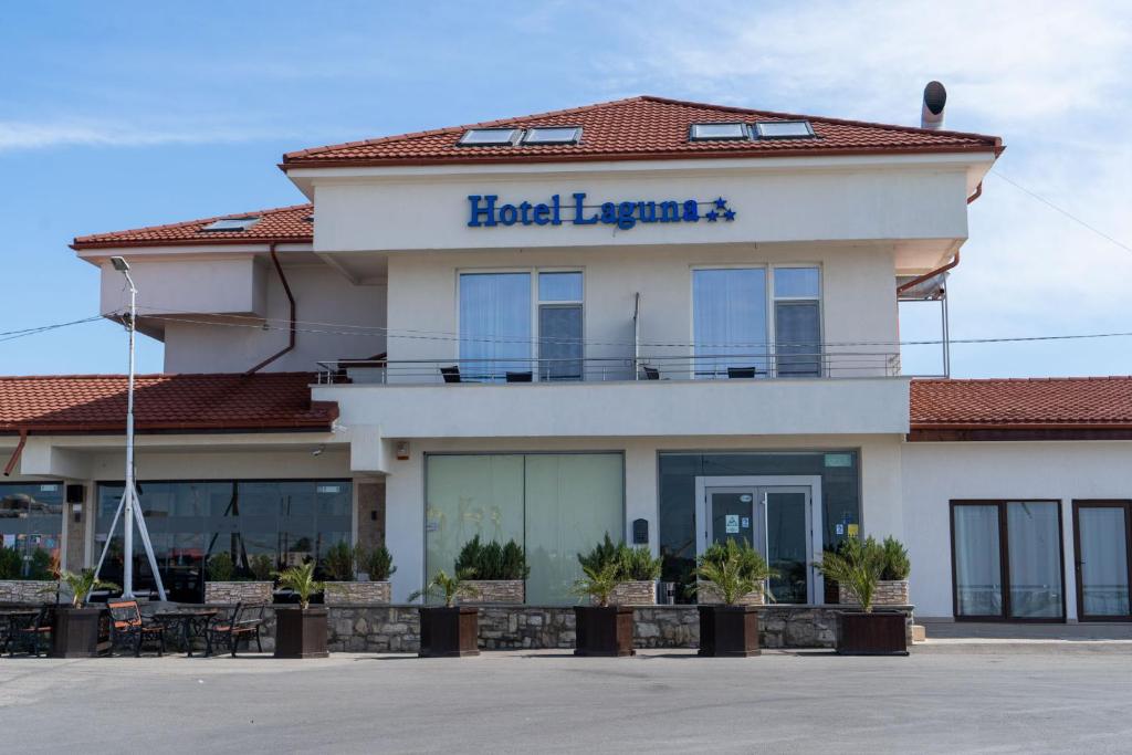 a building with the hotel england sign on it at Hotel Laguna in Mangalia