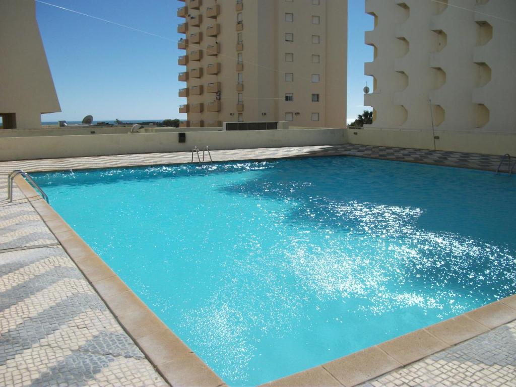 a large swimming pool on top of a building at Varandas SEA VIEW - Praia da Rocha in Portimão