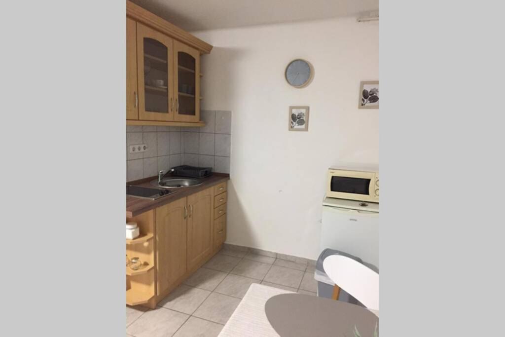 Kuchyňa alebo kuchynka v ubytovaní JAndi apartman