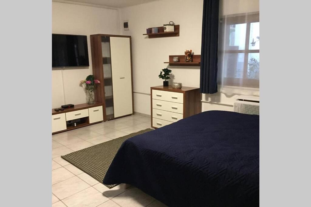 Posteľ alebo postele v izbe v ubytovaní JAndi apartman