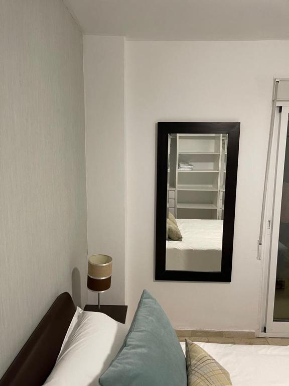 Łóżko lub łóżka w pokoju w obiekcie Apartamento Rio Mar