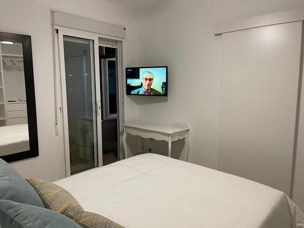 Telewizja i/lub zestaw kina domowego w obiekcie Apartamento Rio Mar